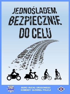 Zdjęcie poglądowe, przedstawiające plakat z napisem: Jednośladem bezpiecznie do celu