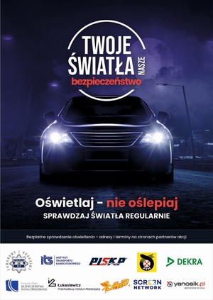 Zdjęcie przedstawiające plakat z pojazdem. Na plakacie jest napis: Twoje światła - nasze bezpieczeństwo&quot;